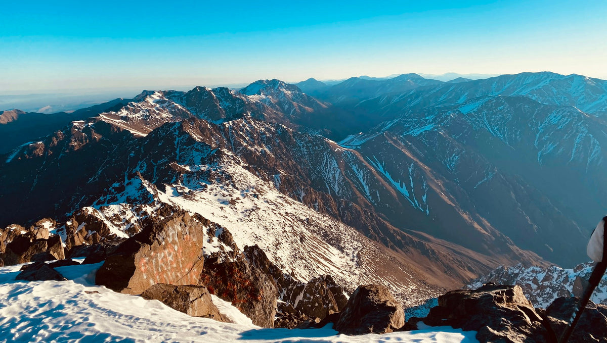 Snow-capped Jbel Toubkal under a blue sky